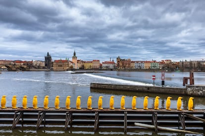 Yellow Penguins art installation by Cracking Art along Vltava river at the Kampa museum