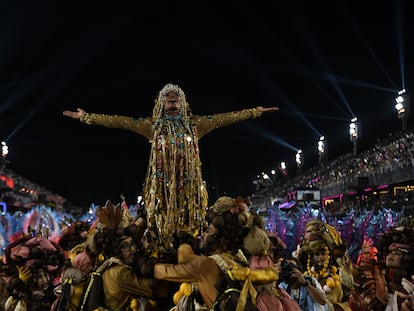 A carnival celebrant plays the part of Rosa María Egipciaca in Rio de Janeiro; February 21, 2023.