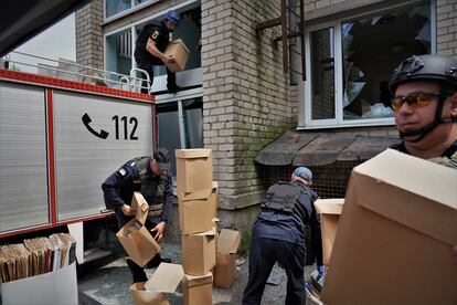 Firefighters work to safeguard the municipal archives in Orikhiv.