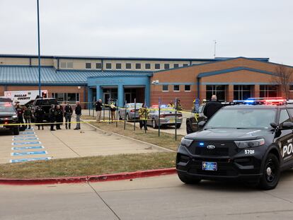 Police vehicles in front of Perry High School, Iowa.