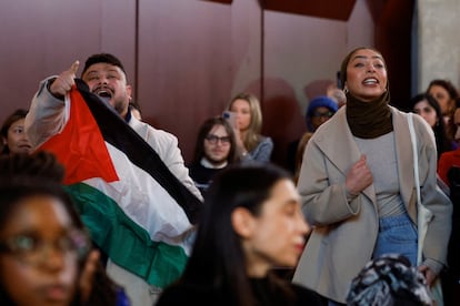 A protestor holds a Palestinian flag at the Hylton Performing Arts Center, as U.S. President Joe Biden attends a campaign event at the performing arts center focusing on abortion rights, in Manassas, Virginia, U.S., January 23, 2024. 