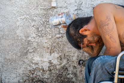 Dee Lee, 34, cools off amid searing heat that was forecast to reach 115 degrees Fahrenheit on July 16, 2023 in Phoenix, Arizona. 