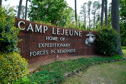 Signage stands on the main gate to Camp Lejeune Marine Base outside Jacksonville, N.C., April 29, 2022