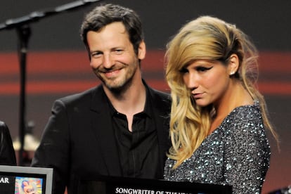 Songwriter Lukasz "Dr. Luke" Gottwalk poses with singer Kesha after receiving his award at the 28th Annual ASCAP Pop Music Awards in Los Angeles