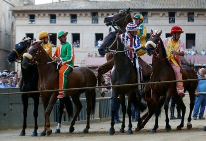 Jockey Luigi Bruschelli of the "Bruco" (Caterpillar) parish struggles with his horse on the starting ropes of the third practices for the Palio of Siena, Italy August 14, 2017. REUTERS/Stefano Rellandini  NO SALES.