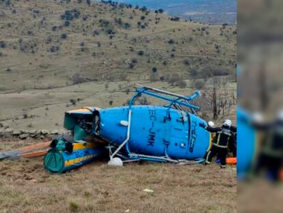 El helicóptero de la DGT accidentado en Robledo de Chavela (Madrid), este domingo.