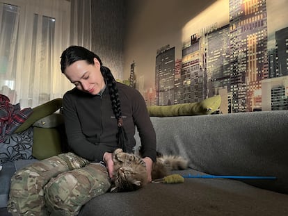 Annya – from the Ochi Drone Brigade – with her cat, Haley, before leaving on a mission to the Bakhmut front.