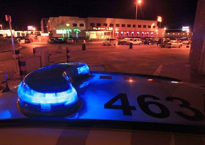 A police patrol vehicle guards the entrance of the sprawling Paradise brothel in La Jonquera.