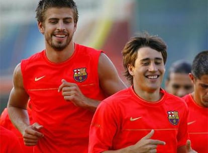 Bojan y Piquet sonríen durante un entrenamiento