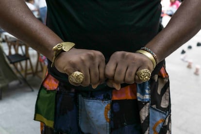 The hands of Daniel Mawuli Quist, with the rings designed by him.