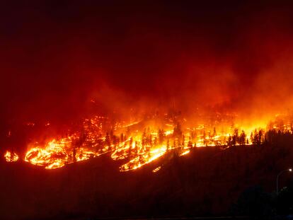 The McDougall Creek wildfire burns in the hills West Kelowna, British Columbia, Canada, on August 17, 2023.