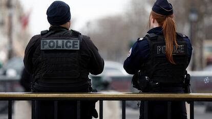 Paris police members patrol on the Champs Elysees avenue near the Arc de Triomphe in Paris, France, February 1, 2024.