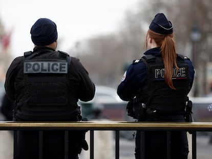 Paris police members patrol on the Champs Elysees avenue near the Arc de Triomphe in Paris, France, February 1, 2024.