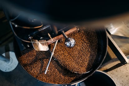 This large coffee roasting machine cools a new batch of organic single origin coffee after the roasting stage. Filmed in Portland, Oregon, USA.