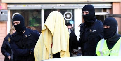 Civil guards escort the father of the family arrested in Badalona on Tuesday.