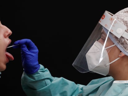 A nurse doing a PCR test in Pamplona, in Spain's Navarre region, where coronavirus cases are soaring again.