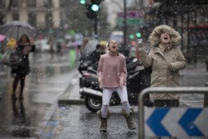 Children play in the snow in Madrid.