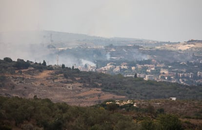 Smoke rises from the village of Dhayra, as seen in the Lebanese town of Marwahin, in southern Lebanon, on October 11, 2023.