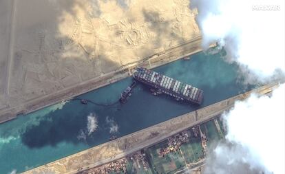 STUCK SHIP EVER GIVEN, SUEZ CANAL -- MARCH 26, 2021:  Maxar's WorldView-2 collected new high-resolution satellite imagery of the Suez canal and the container ship (EVER GIVEN) that remains stuck in the canal north of the city of Suez, Egypt.  Please use: Satellite image (c) 2021 Maxar Technologies.