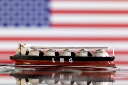 Model of LNG tanker is seen in front of the U.S. flag in this illustration taken May 19, 2022.