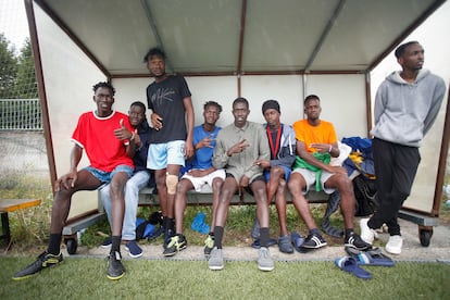 Young people pose on the bench of the soccer field on Tuesday. 