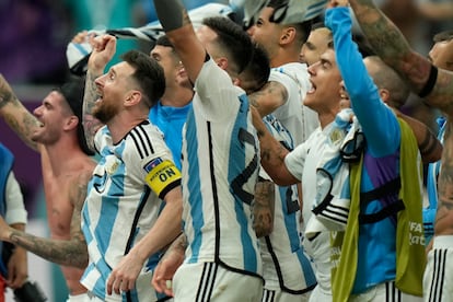 Argentina's Lionel Messi, left, celebrates with teammates after defeating the Netherlands off penalties during the World Cup quarterfinal soccer match between the Netherlands and Argentina, at the Lusail Stadium in Lusail, Qatar, Saturday, Dec. 10, 2022. (AP Photo/Francisco Seco)