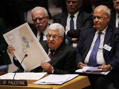 Palestinian President Mahmoud Abbas holds a map as he speaks at the United Nations Security Council in New York in November.