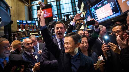 The New York Stock Exchange Building in 2014, with Jack Ma from Chinese mega-corporation Alibaba, surrounded by young financial workers.