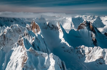 View from a small plane of the snowy peaks and endless mountains of Tombstone Territorial Park, Canada.