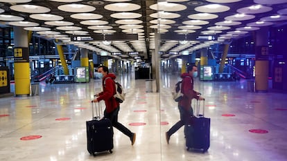 A traveler at Madrid's Barajas Airport on Wednesday.