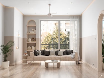 A spacious living room with a ceiling fan.