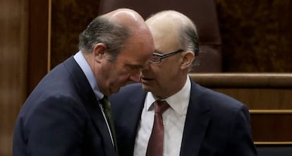 Luis de Guindos y Cristóbal Montoro.