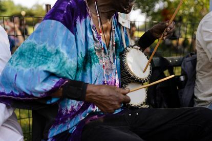 A rumba musician plays in the crowd.