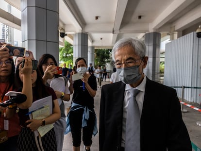 Martin Lee, right, the founding chairman of the city’s Democratic Party, leaves high court after a ruling on a challenge that he and six other activists had filed against their conviction on charges of organizing and taking part in an unauthorized assembly in Hong Kong, Monday, Aug. 14, 2023