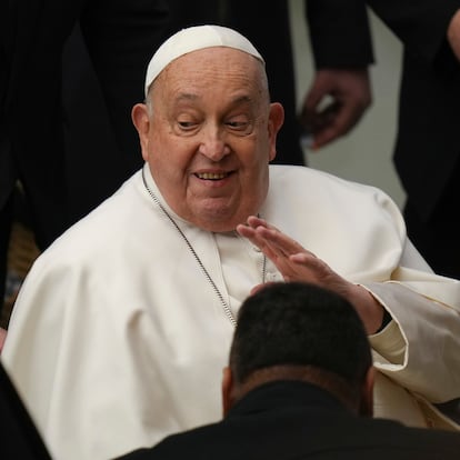 Pope Francis salutes faithful during his weekly general audience in the Paul VI Hall, at the Vatican, Wednesday, Feb. 12, 2025. (AP Photo/Alessandra Tarantino)