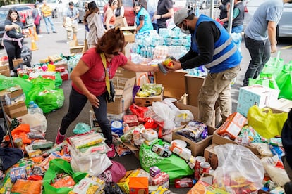Volunteers sort donations for people affected by Hurricane Otis at the Estadio Olimpico Universitario in Mexico City, on October 26, 2023. 