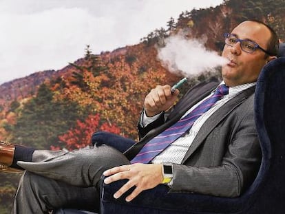 Manuel Mu&ntilde;oz, head of the Spanish National Electronic Cigarette Association, enjoys a vape. 