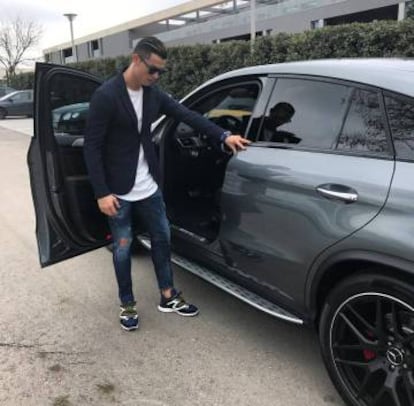 Cristiano Ronaldo with one of his luxury cars.