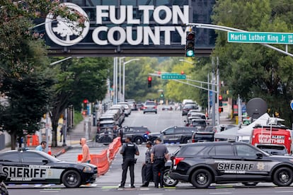 Fulton County Sheriff's Office deputies block a road as enhanced security measures are implemented outside the Fulton County Courthouse ahead of a possible grand jury indictment against Donald Trump.