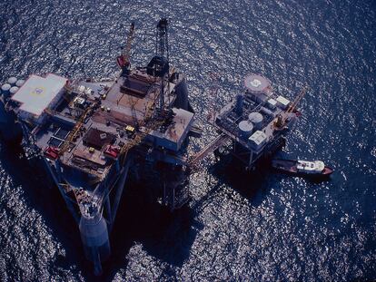 Offshore drilling rig next to a production platform in the Gulf of Mexico.