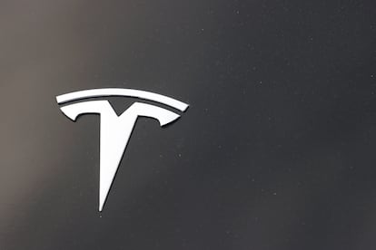 The Tesla company logo is seen on the hood of an unsold vehicle at a dealership on Aug. 9, 2020, in Littleton, Colo.