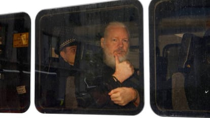 Assange in transfer after being detained in London.