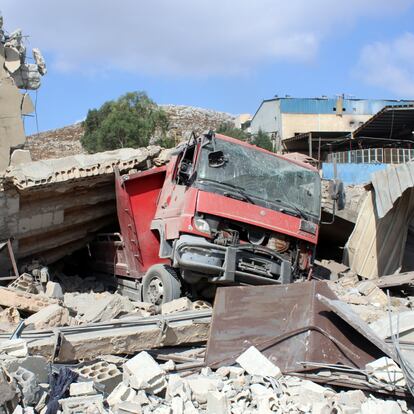 Nabatieh (Lebanon), 01/01/2000.- A truck under the rubble at an industrial area hit by an airstrike in Wadi Al Kfour, Nabatieh province, southern Lebanon, 17 August 2024. According to the Lebanese Ministry of Health, at least ten people were killed, most of them of Syrian nationality, and at least four others were injured in an Israeli airstrike that targeted a cement factory in Wadi Al Kfour in Nabatieh, southern Lebanon. The Israel Defence Forces (IDF) confirmed on 17 August to have carried out an overnight strike on a 'Hezbollah weapon storage facility' in Nabatieh. (Líbano, Siria, Hizbulá/Hezbolá) EFE/EPA/STR
