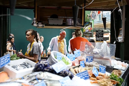 People shop at Borough Market in London, Britain July 19, 2023.