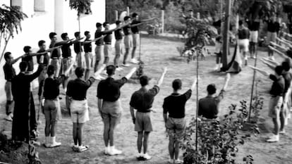 An image from the film in which Father Llanos appears on the far left with the Falangist Youth.