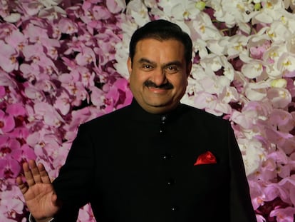 Gautam Adani poses during a wedding reception in Mumbai, India in 2019.