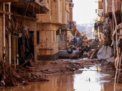 Overturned cars lay among other debris caused by flash floods in Derna, eastern Libya, on September 11, 2023.