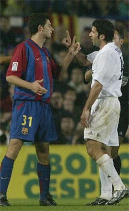 Figo discute con Motta durante el partido del sábado.