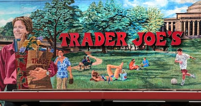 In this Aug. 13, 2019, file photo, Trader Joe's logo hangs on a mural at it's market in Cambridge, Mass.