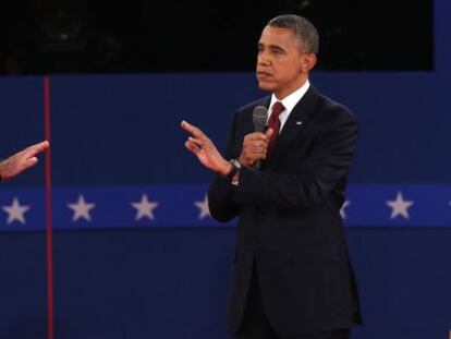 Obama y Romney se enfrentan en el debate.